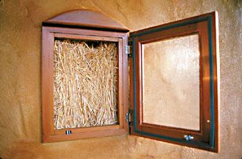 The "truth" window reveals the straw bale secret behind the home of Krisin and Mark Sullivan.